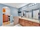 Dual sink bathroom with modern fixtures, generous cabinet space, and a separate walk in shower at 5883 Great Salt Ct, Lakeland, FL 33805