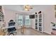 Bright bedroom features a desk, television, modern lighting and a floor to ceiling display cabinet at 5883 Great Salt Ct, Lakeland, FL 33805