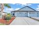 Charming single-Gathering home with a two-car garage, manicured landscaping, and a beautiful lawn at 5883 Great Salt Ct, Lakeland, FL 33805