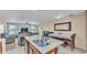 Open concept kitchen with granite counters, stainless appliances, an island, and open views of the living areas at 5883 Great Salt Ct, Lakeland, FL 33805