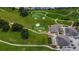 Scenic aerial view of a golf course community with lush greens, fairways, and elegant clubhouse at 6059 Condor Dr, Lakeland, FL 33809
