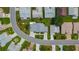 Aerial view of a well-maintained neighborhood with lush greenery and neatly arranged homes at 6059 Condor Dr, Lakeland, FL 33809