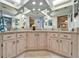Bright bathroom featuring a double vanity with granite countertops and ample lighting at 6059 Condor Dr, Lakeland, FL 33809