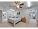 Bedroom featuring a cozy quilt bed and views into an organized walk-in closet and a bathroom at 6059 Condor Dr, Lakeland, FL 33809