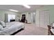 Open bedroom has carpeted flooring and a view of the bathroom and closet at 6059 Condor Dr, Lakeland, FL 33809