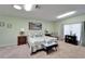 Bright bedroom with soothing paint, stylish furnishings, and decorative mountain scene at 6059 Condor Dr, Lakeland, FL 33809