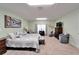 Spacious carpeted bedroom featuring a television and relaxing seating area at 6059 Condor Dr, Lakeland, FL 33809