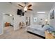 Bedroom with a ceiling fan, mirrored closet, and a doorway to a bathroom at 6059 Condor Dr, Lakeland, FL 33809
