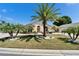 Charming home with a well-manicured lawn featuring mature palm trees and meticulous landscaping at 6059 Condor Dr, Lakeland, FL 33809