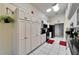 Spacious kitchen featuring black countertops, white cabinets, and stainless steel appliances at 6059 Condor Dr, Lakeland, FL 33809