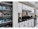 Kitchen featuring black granite countertops, stainless steel appliances, and a pantry at 6059 Condor Dr, Lakeland, FL 33809