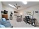 A cozy living room offers a mix of relaxation and productivity with a desk and comfortable seating at 6059 Condor Dr, Lakeland, FL 33809