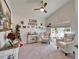 Bright living room boasts a high ceiling, arched window, plush chairs, and festive holiday decor at 6059 Condor Dr, Lakeland, FL 33809