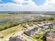 Beautiful aerial view of a neighborhood near a wetland area, offering a serene and natural backdrop at 661 Black Eagle Dr, Groveland, FL 34736