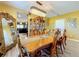 Elegant dining room with a wooden table, a crystal chandelier, and ornate decorations, perfect for hosting gatherings at 661 Black Eagle Dr, Groveland, FL 34736