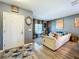 Stylish living room with modern decor, comfortable seating, and ample natural light, creating a welcoming atmosphere at 661 Black Eagle Dr, Groveland, FL 34736