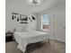 Minimalist bedroom with adventure-themed decor, bright natural light, and a cozy atmosphere at 728 Trotters Dr, Eagle Lake, FL 33839