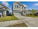 Charming two-story home featuring neutral gray siding, manicured lawn and an attached two-car garage at 728 Trotters Dr, Eagle Lake, FL 33839