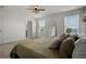 Bright main bedroom with large windows offering scenic views and plush bedding at 728 Trotters Dr, Eagle Lake, FL 33839
