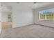 Carpeted bedroom with great natural light from the window and a ceiling fan for comfort at 7947 Lake James Blvd, Lakeland, FL 33810