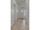 Bright entryway featuring neutral tile flooring, a transom window, and a paneled front door at 7947 Lake James Blvd, Lakeland, FL 33810