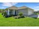 Charming single-story home with well-manicured lawn and an attached two-car garage at 7947 Lake James Blvd, Lakeland, FL 33810