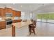Open-concept kitchen featuring stainless steel appliances, and a breakfast bar with seating at 7947 Lake James Blvd, Lakeland, FL 33810