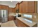 Well-equipped kitchen featuring stainless steel appliances, granite countertops, and plentiful cabinetry at 7947 Lake James Blvd, Lakeland, FL 33810