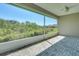Spacious screened patio with brick pavers and a peaceful view of the lush backyard at 7947 Lake James Blvd, Lakeland, FL 33810
