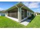 Screened in lanai featuring neutral paint and views of the yard at 7947 Lake James Blvd, Lakeland, FL 33810