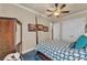 Bedroom features a four-poster bed, ceiling fan, and double door closet at 914 Christina Chase Dr # Drive, Lakeland, FL 33813