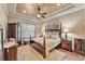 Primary bedroom showcases a decorative ceiling, four-post bed, soft lighting, and ample space at 914 Christina Chase Dr # Drive, Lakeland, FL 33813
