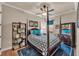 Cozy bedroom boasts a four-poster bed, ceiling fan, and natural light from the window at 914 Christina Chase Dr # Drive, Lakeland, FL 33813