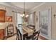 Cozy dining area featuring a decorative chandelier, natural light, and view of the outdoor patio at 914 Christina Chase Dr # Drive, Lakeland, FL 33813