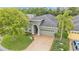 Front elevation of home with well-maintained landscaping and paver driveway at 914 Christina Chase Dr # Drive, Lakeland, FL 33813