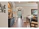 Inviting hallway with elegant decor, arched doorways, and wood-look tile flooring at 914 Christina Chase Dr # Drive, Lakeland, FL 33813