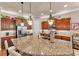 Spacious kitchen with a large granite island, custom cabinets, modern appliances, and great natural light at 914 Christina Chase Dr # Drive, Lakeland, FL 33813