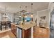 Open-concept kitchen with granite countertops, stainless steel appliances, and a large center island at 914 Christina Chase Dr # Drive, Lakeland, FL 33813