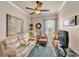 This living room features a cream-colored couch, a patterned rug, accent lighting, and decorative wall art at 914 Christina Chase Dr # Drive, Lakeland, FL 33813
