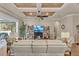 Cozy living room featuring recessed ceiling with fan, sliding doors to the lanai, and plenty of seating at 914 Christina Chase Dr # Drive, Lakeland, FL 33813