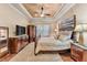 Comfortable main bedroom featuring a decorative ceiling, ample natural light, and elegant furnishings at 914 Christina Chase Dr # Drive, Lakeland, FL 33813