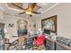 An office with a black desk, a red rolling chair, built-in black cabinets, and decorative wall art at 914 Christina Chase Dr # Drive, Lakeland, FL 33813