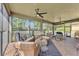 Spacious screened-in patio with seating areas, ceiling fans, and tiled flooring at 914 Christina Chase Dr # Drive, Lakeland, FL 33813