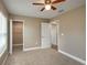 Spacious bedroom with carpet, ceiling fan, and closet at 1013 Rhodes S Rd, Haines City, FL 33844