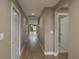 Spacious hallway with wood-look flooring leading to living areas and bedrooms at 1013 Rhodes S Rd, Haines City, FL 33844