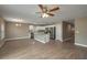 Bright kitchen with stainless steel appliances, white cabinets, and an island with stone countertops at 1013 Rhodes S Rd, Haines City, FL 33844