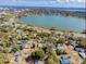 Aerial view of residential neighborhood with lake and city skyline in distance at 1028 W Marjorie St, Lakeland, FL 33815