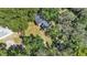 Aerial view showcasing the home's setting among mature trees and landscaping at 1028 W Marjorie St, Lakeland, FL 33815