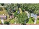 Aerial view of homes on tree-lined streets with lush greenery at 1028 W Marjorie St, Lakeland, FL 33815