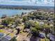 Aerial view of neighborhood homes with a scenic lake in the background at 1028 W Marjorie St, Lakeland, FL 33815
